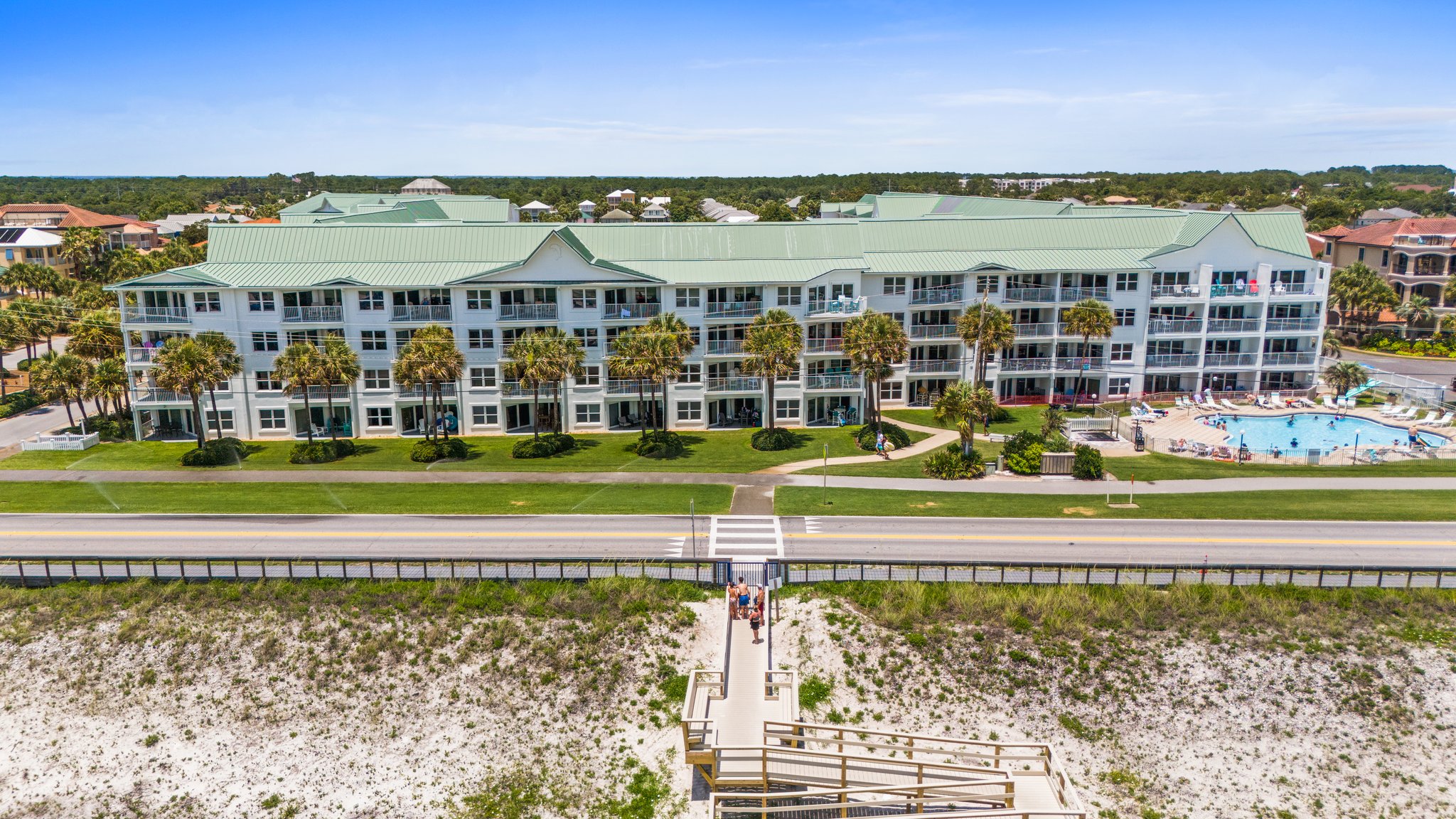 Maravilla heated pool and hot tub at evening with tennis and pickleball courts nearby